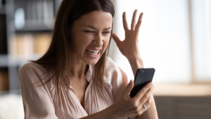 A woman frustrated after she keeps receiving spam texts.